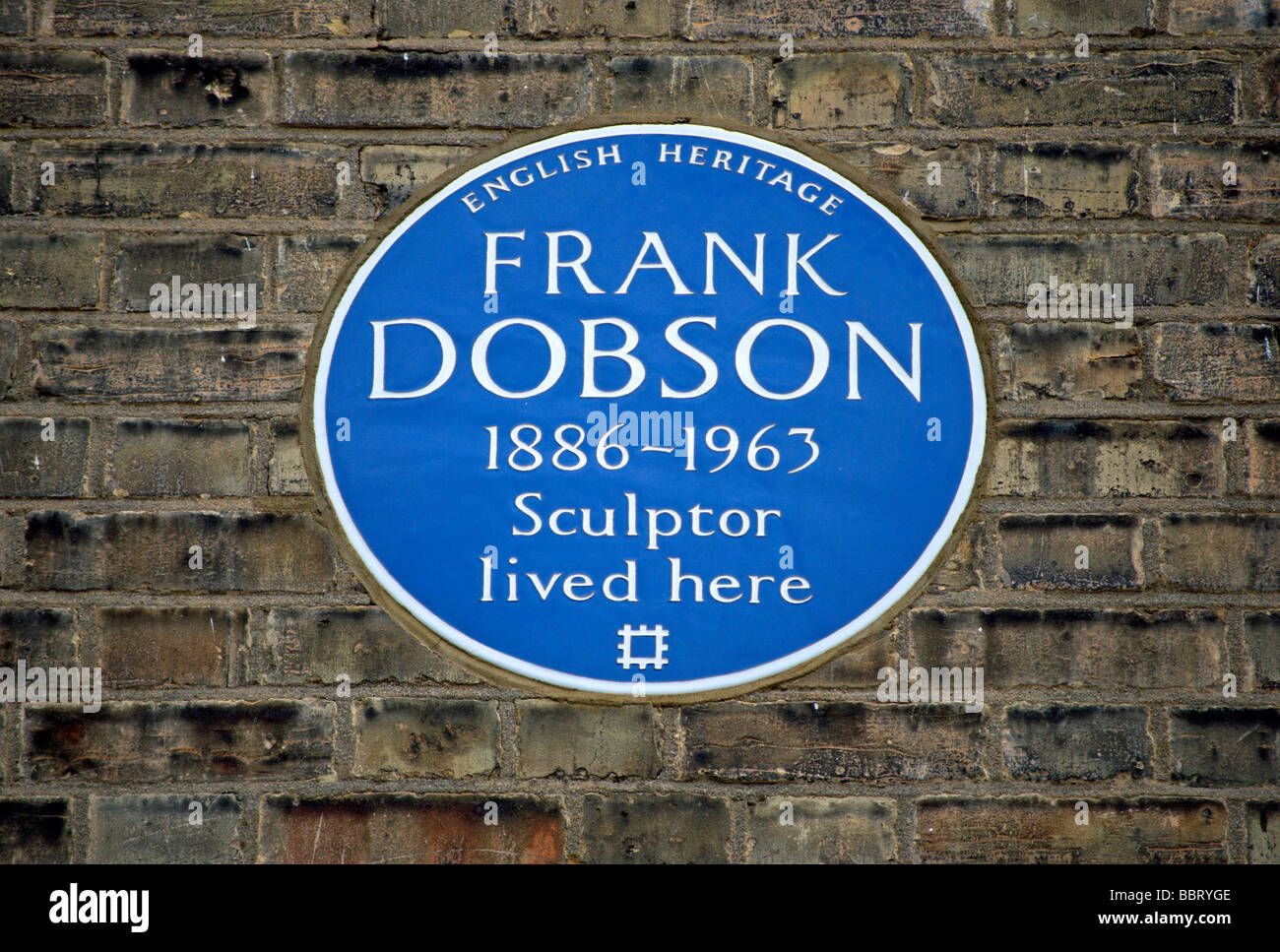 english heritage blue plaque marking a former home of sculptir frank dobson, in kensington, london, england Stock Photo