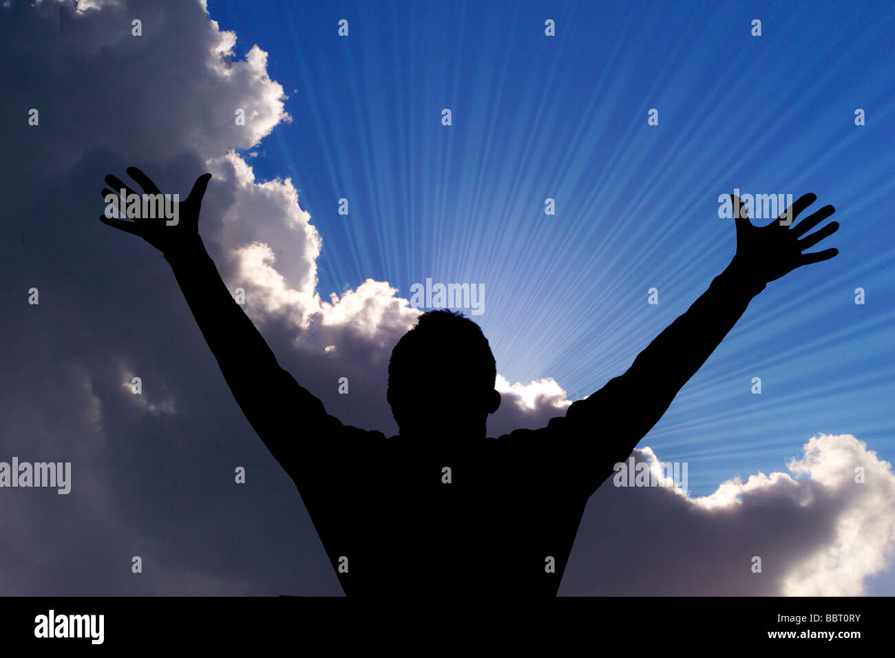 ecstatic man outstretched arms and sunrise Stock Photo - Alamy