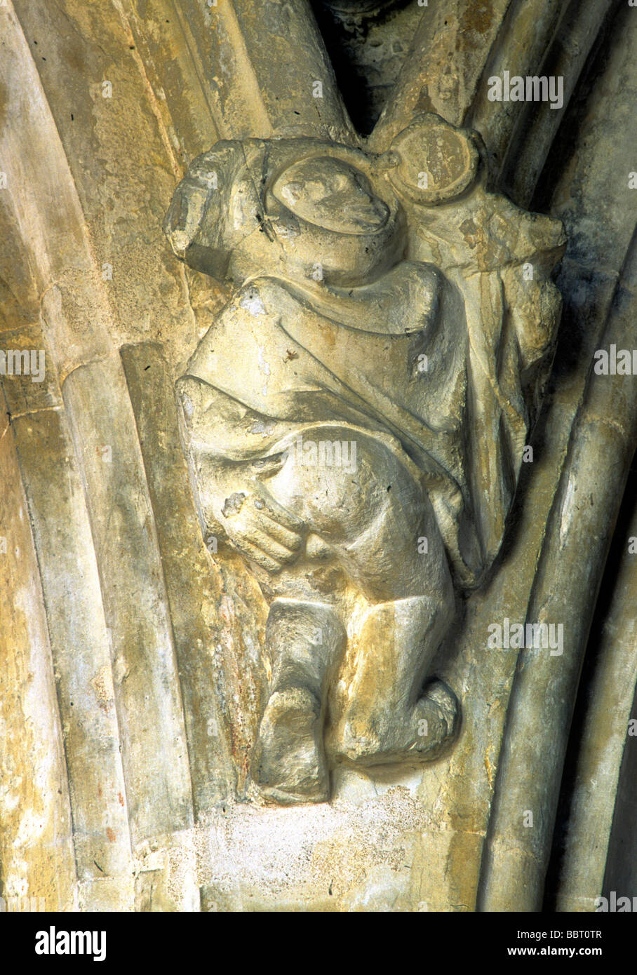 Man baring buttocks stone corbel Cley next the Sea church interior Norfolk East Anglia England UK English carving Stock Photo