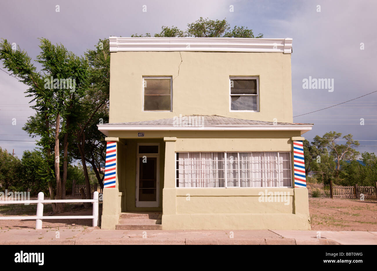 The local barbershop with it's painted poles, in Carrizozo, New Mexico. Stock Photo