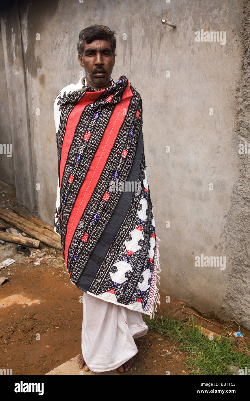 A male member of the Toda tribe, one of India's Scheduled Tribes, wears a handwoven Toda cloak. Stock Photo