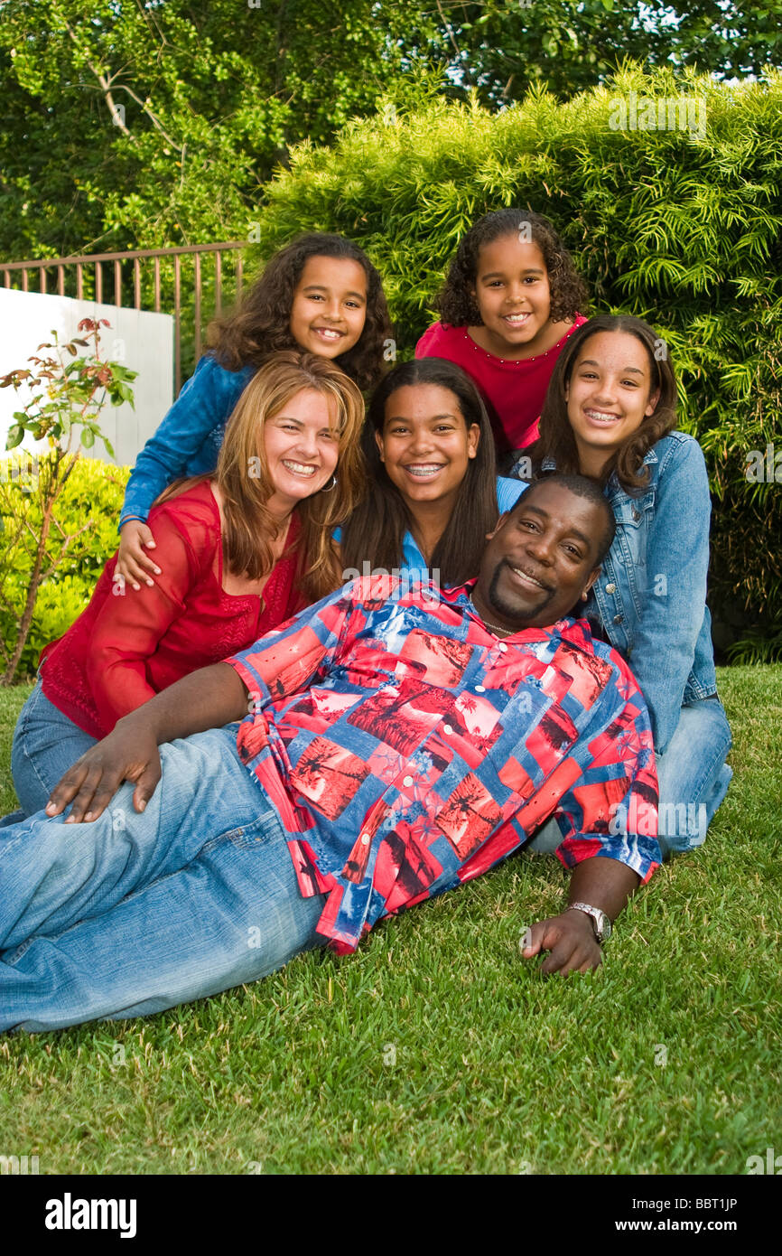Portrait of Interracial Inter racial African American Caucasian family in garden looking at camera eye contact  MR  © Myrleen Pearson Stock Photo