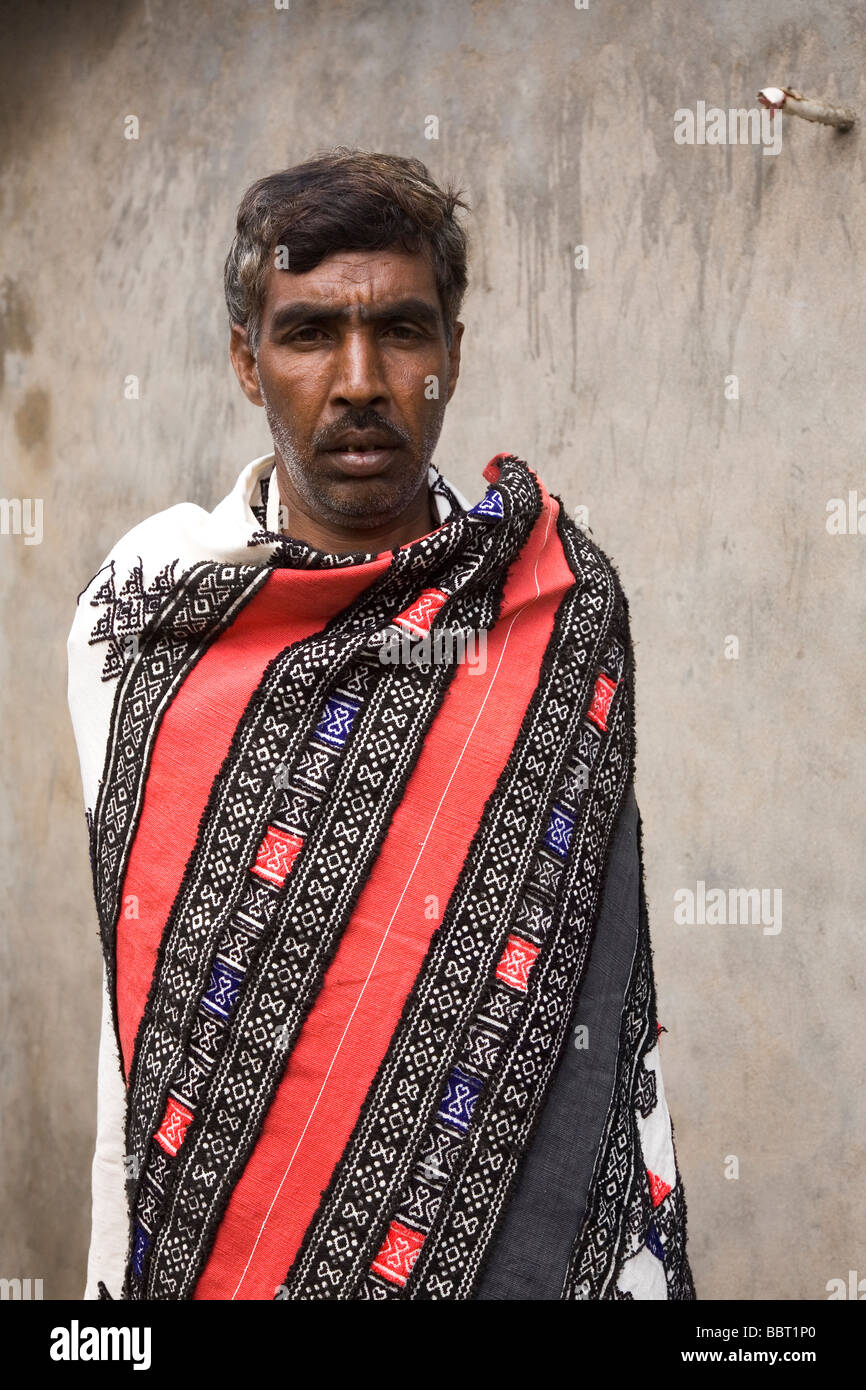 A male member of the Toda tribe, one of India's Scheduled Tribes, wears a handwoven Toda cloak. Stock Photo