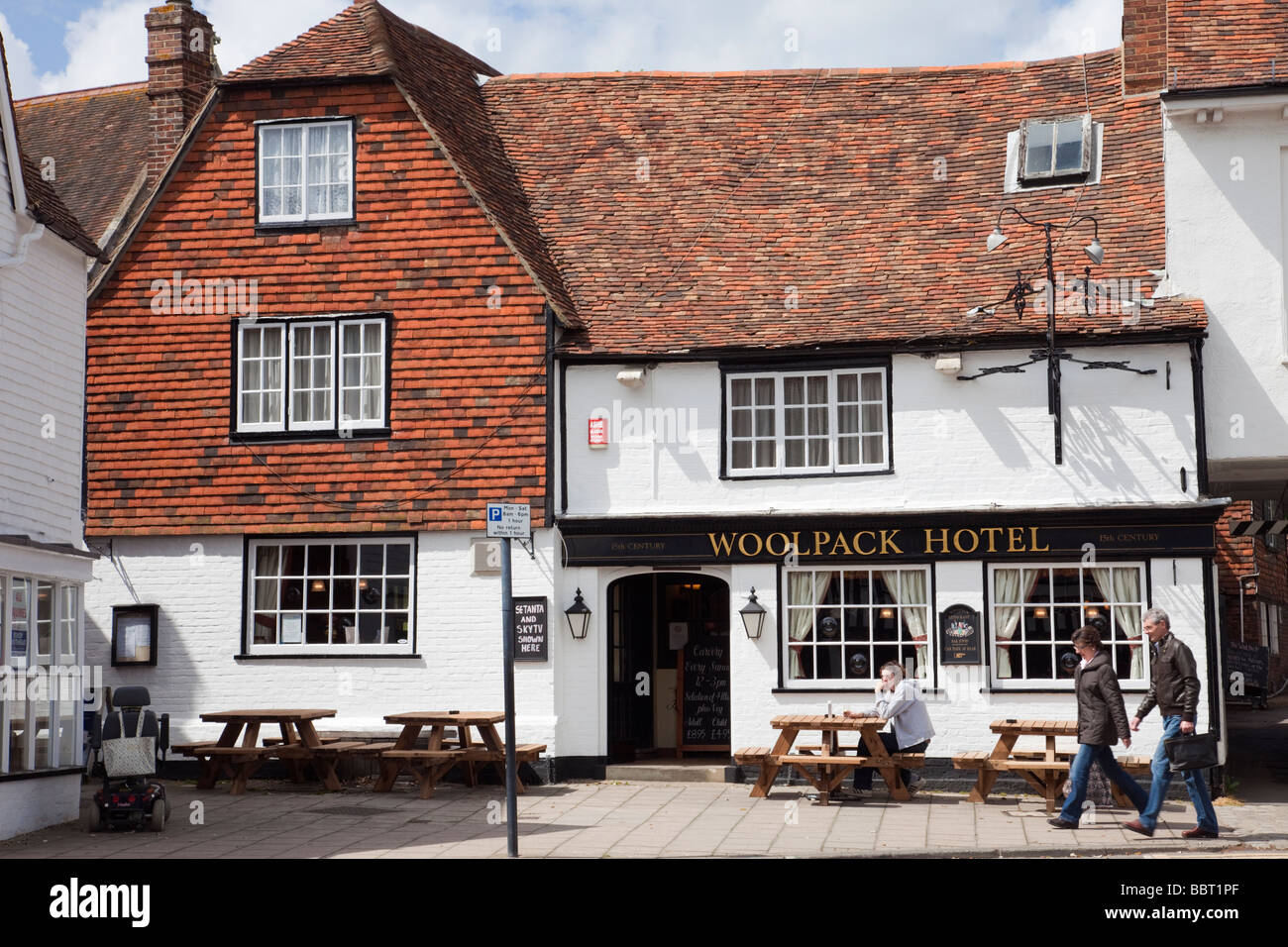 The Woolpack hotel 15th century pub exterior with tables outside in small historic Wealden Cinque Port town. Tenterden Kent England UK Stock Photo
