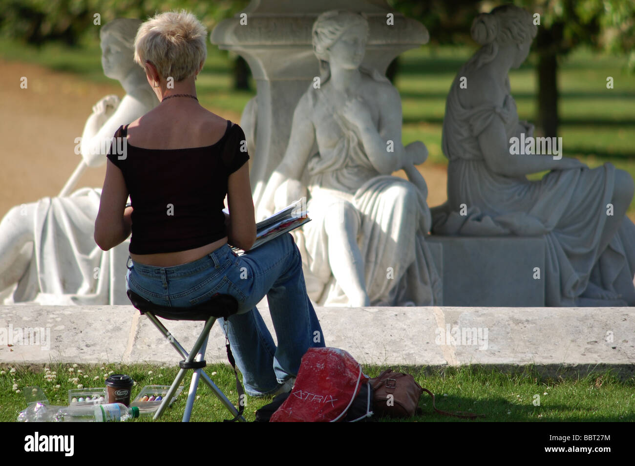 An artist works on a painting of a statue at Wrest Park in Bedfordshire. Stock Photo