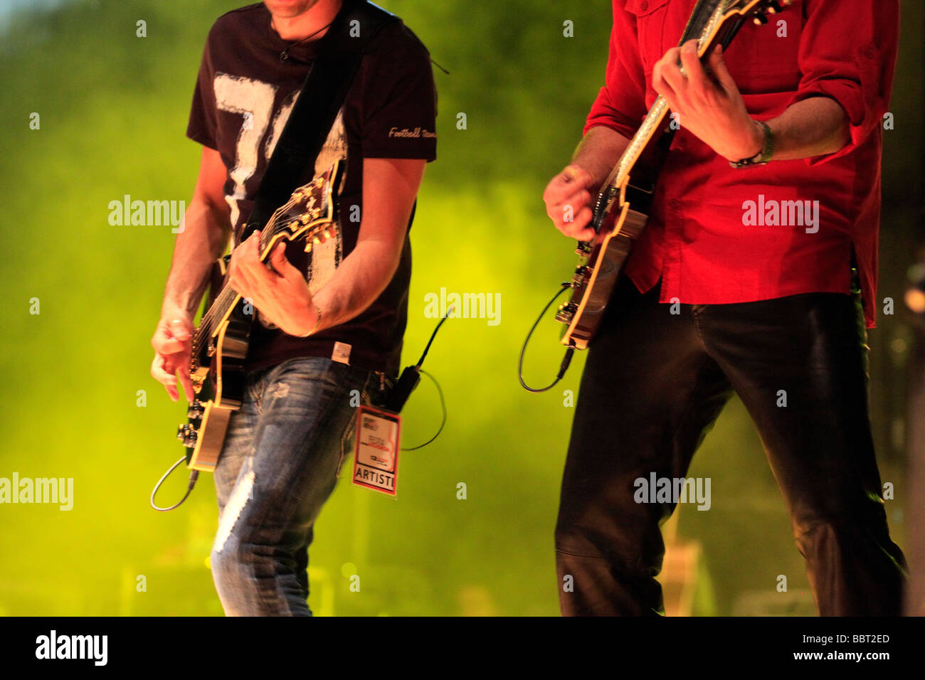 rock musicians playing at a live concert Stock Photo