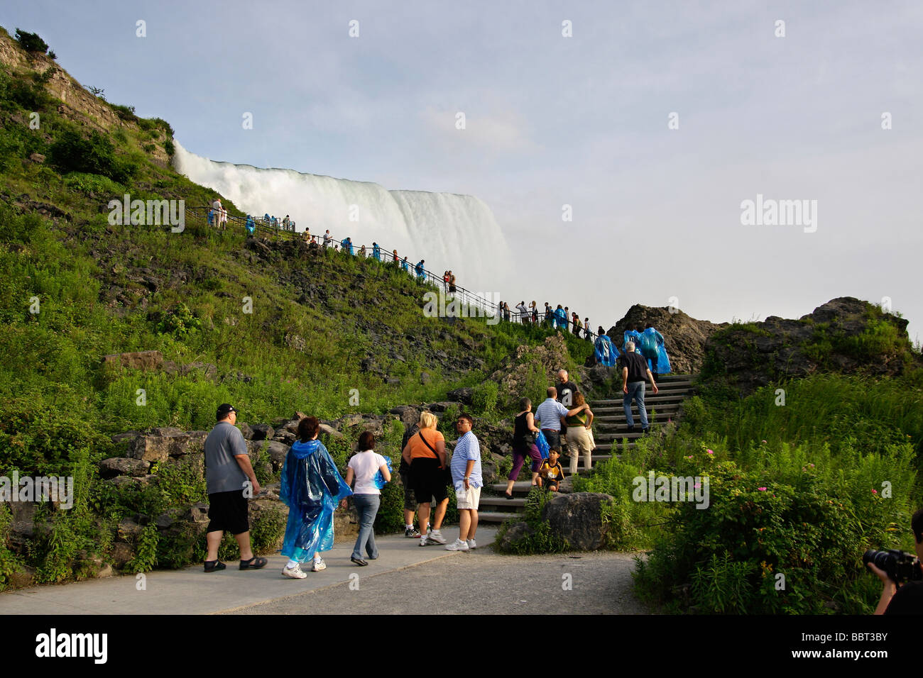 Edge of Niagara falls waterfall with people in New York NY State Park USA low angle from below Impressive hi-res Stock Photo