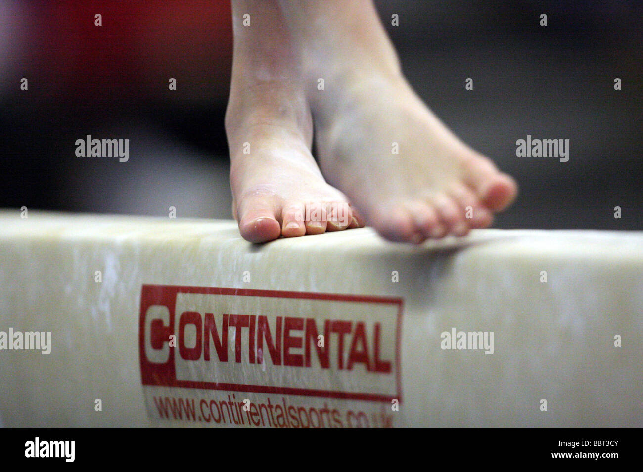 gymnasts feet on the balance beam Stock Photo Alamy