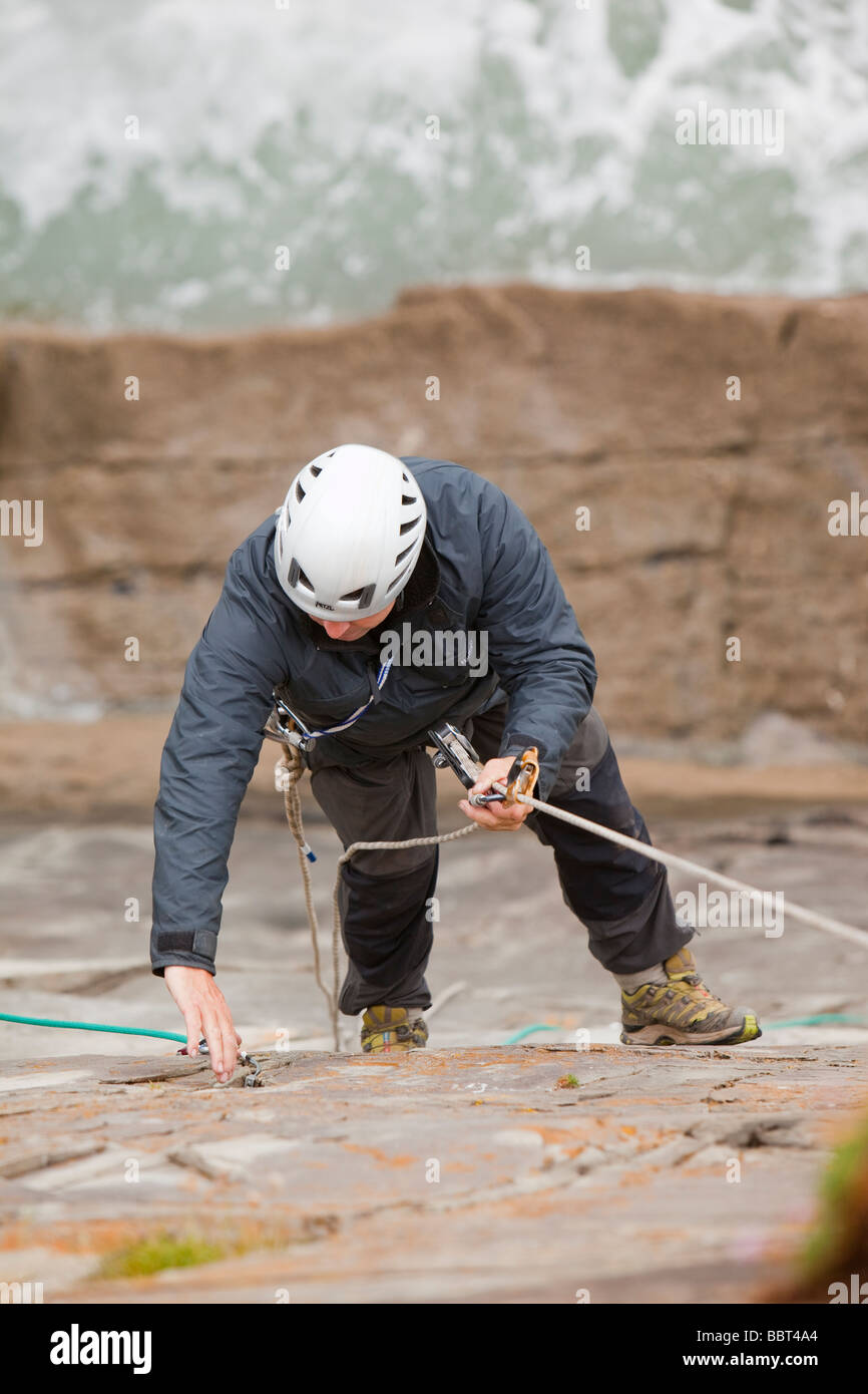 Climbers on a sea cliff climb on Baggy Point near Croyde in north Devon