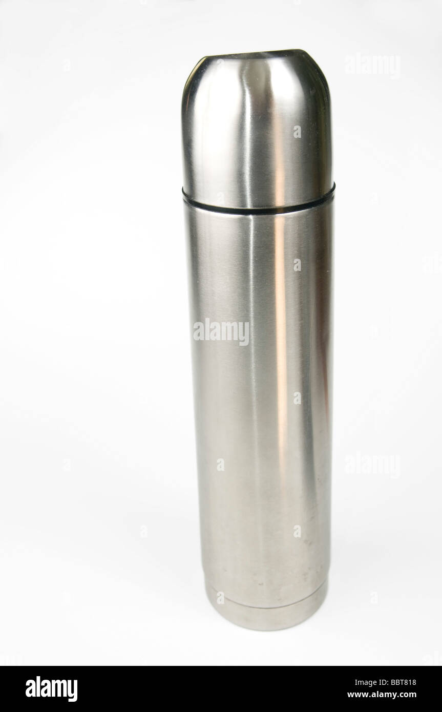 Close-up top above view woman hand hold steel thermos pouring hot
