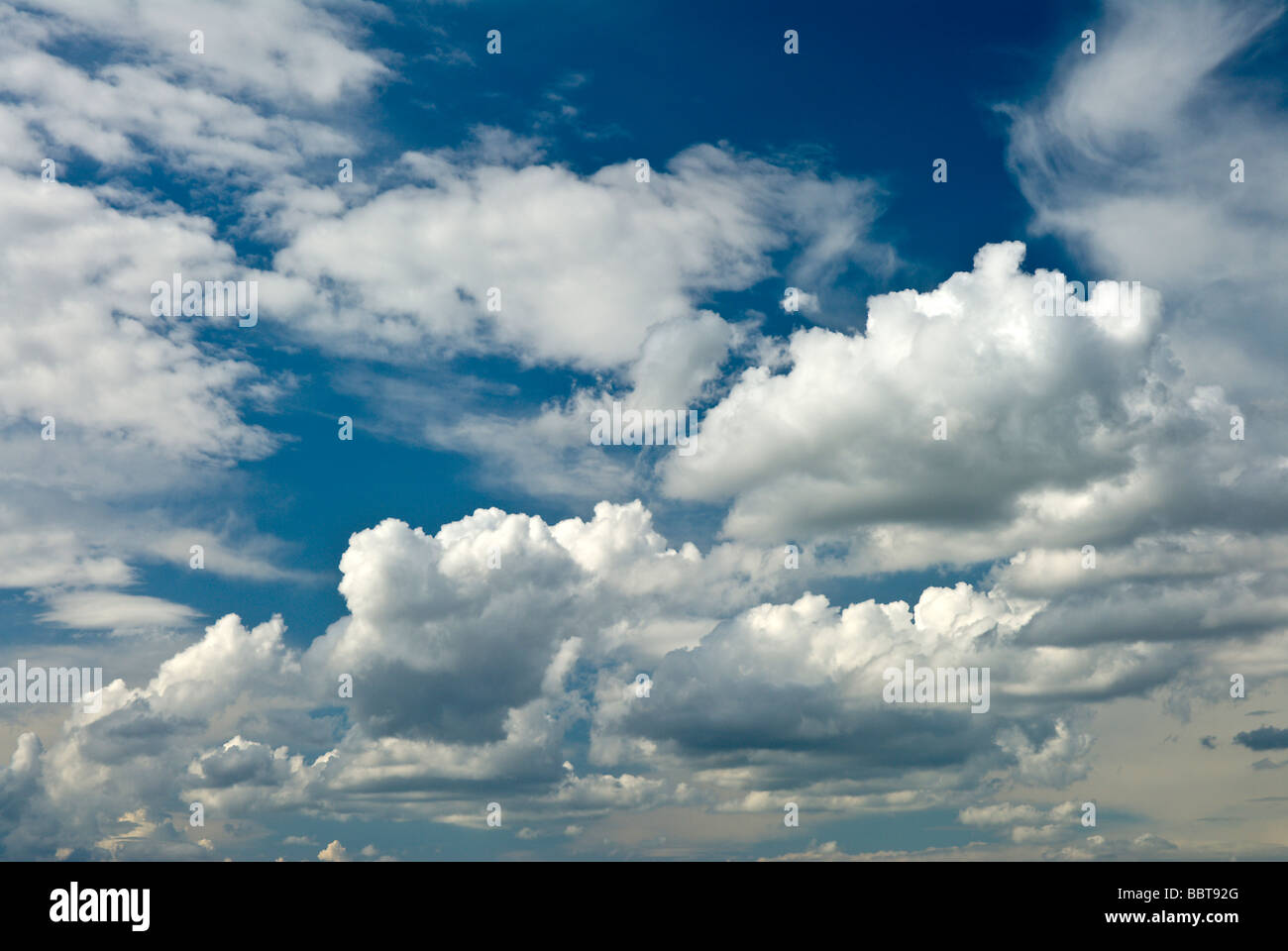 group of white clouds in a blue sky on a sunny day Stock Photo