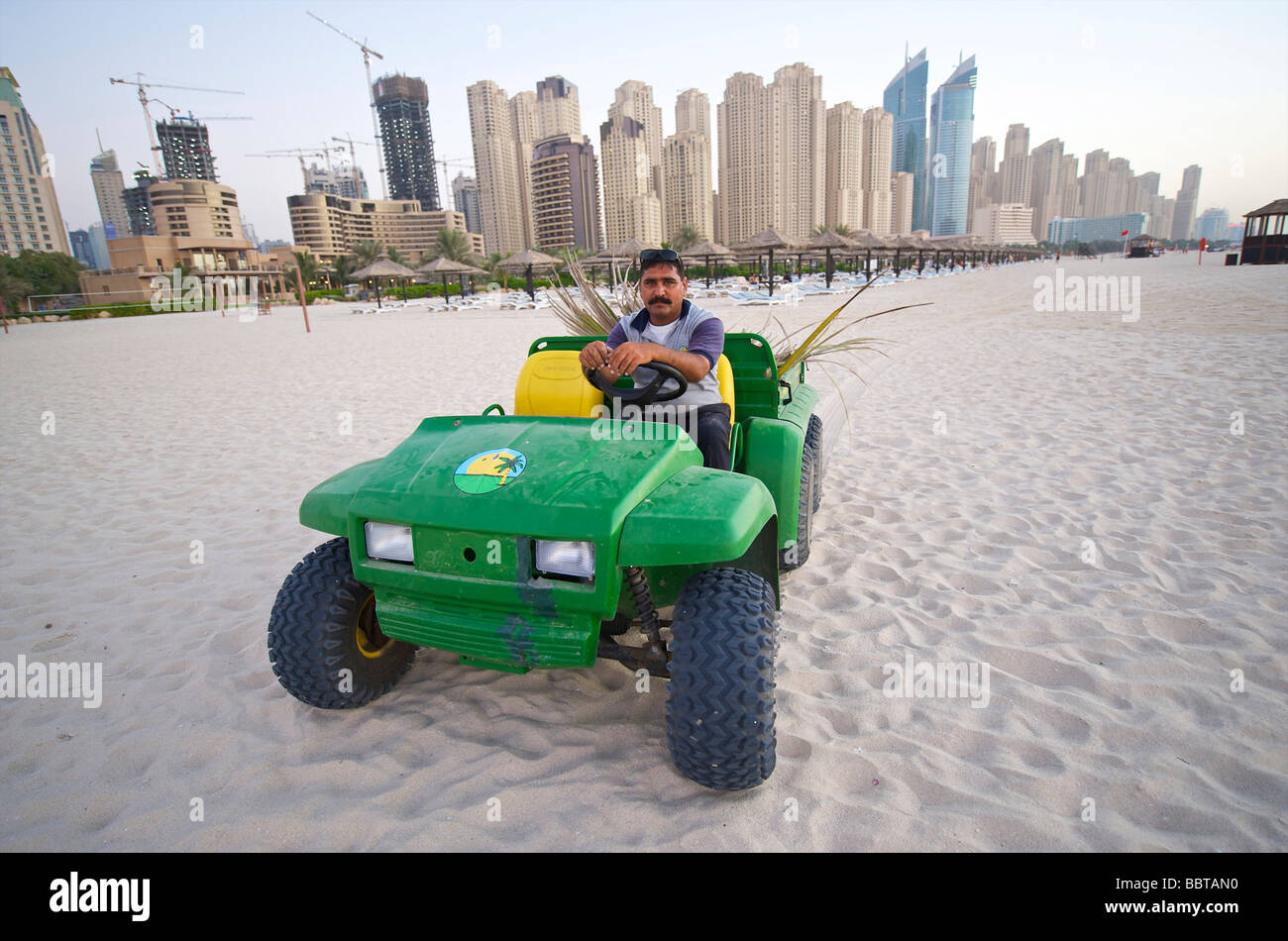 Dubai cleaning the beach of the Dubai Marina Stock Photo Alamy