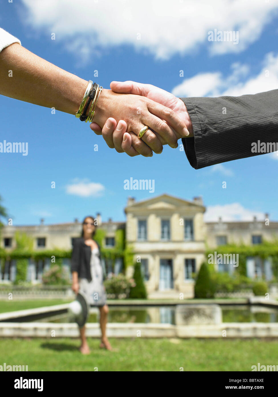 People shaking hands after a sale Stock Photo