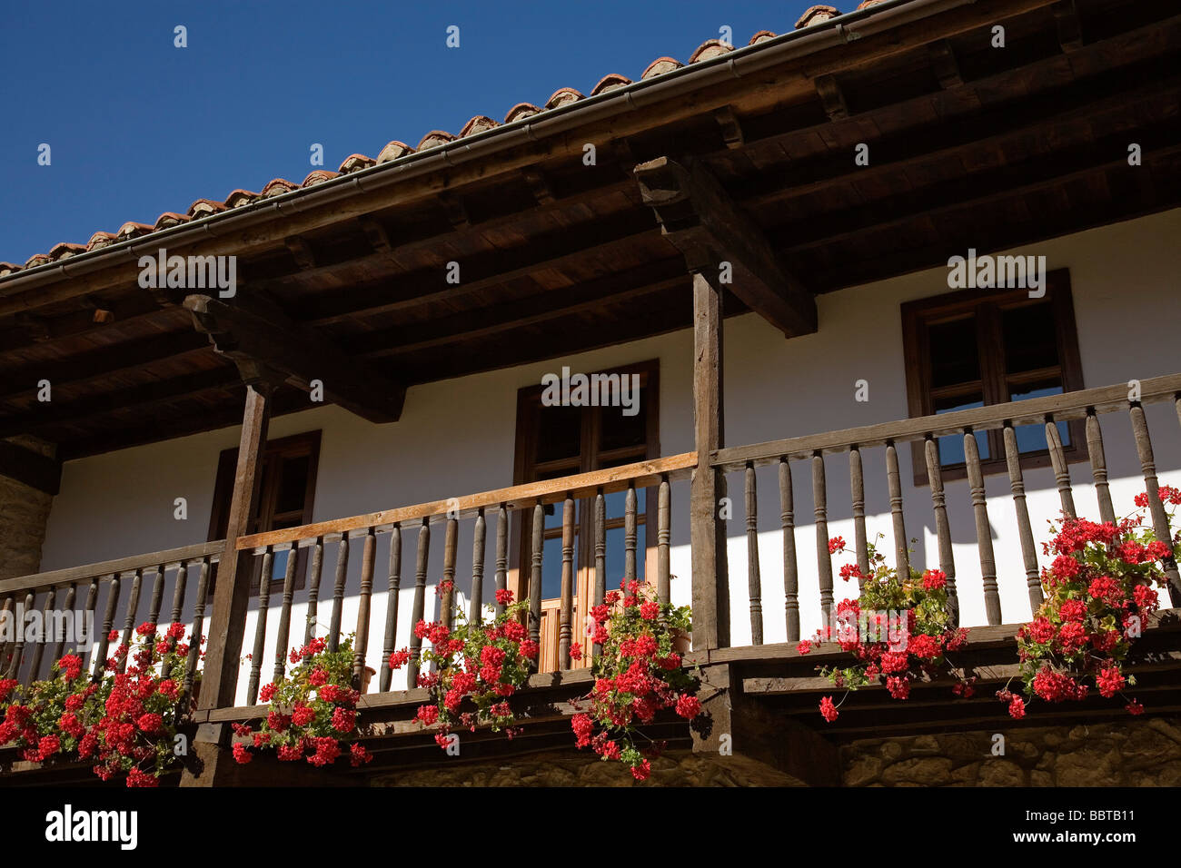 Balcony with a Flowers of a Rural House in the Village of Mogrovejo Shire of Liebana Picos de Europa Cantabria Spain Stock Photo