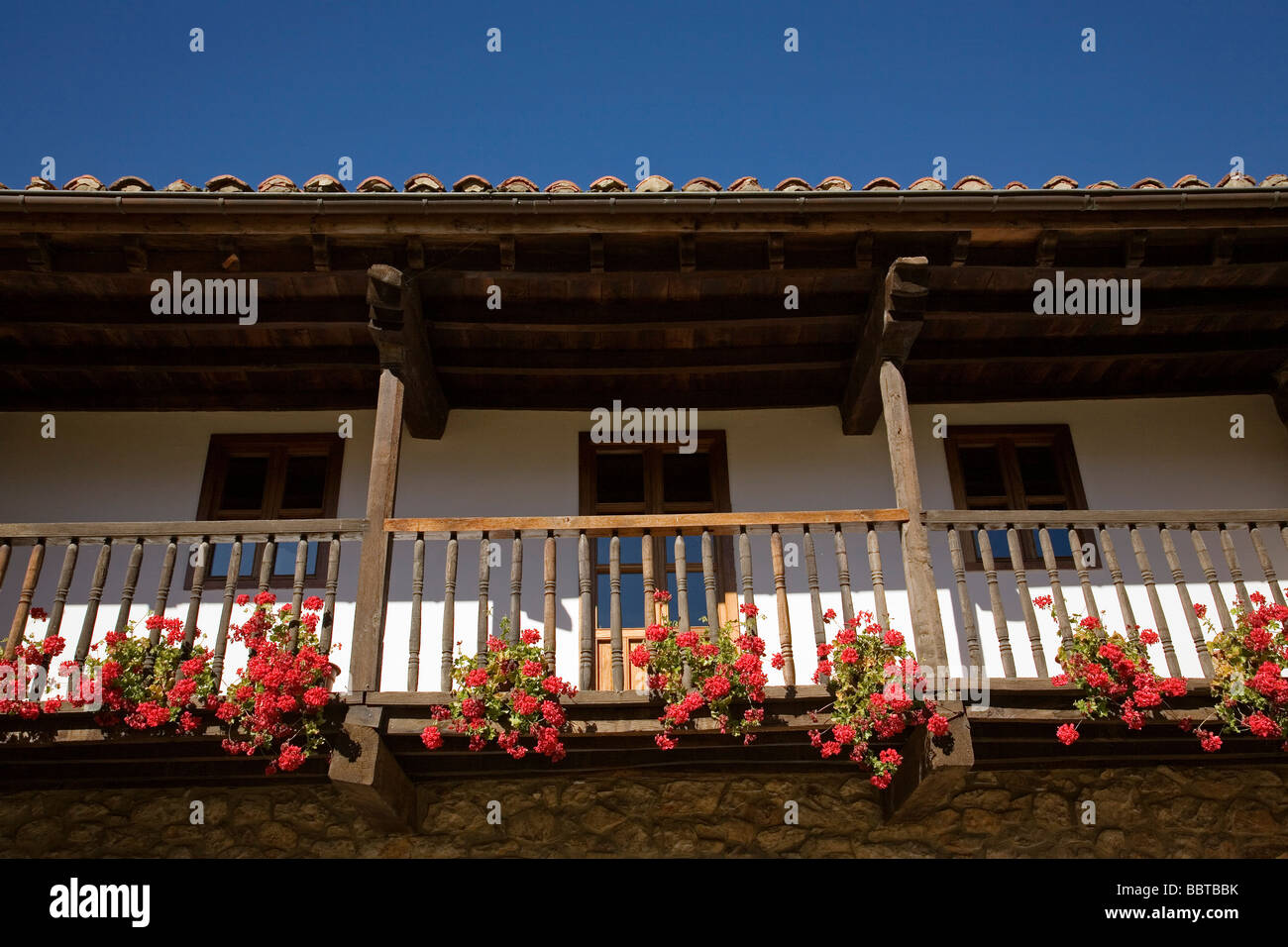 Balcony with a Flowers of a Rural House in the Village of Mogrovejo Shire of Liebana Picos de Europa Cantabria Spain Stock Photo