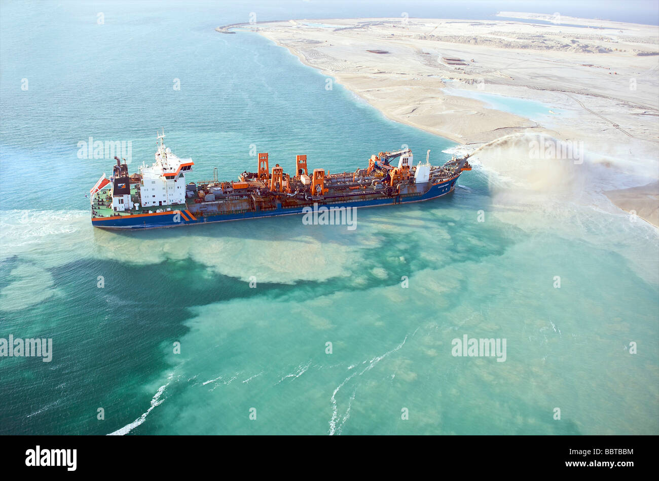 Dubai the World a dredge ship reclaiming land for the new harbour Stock Photo
