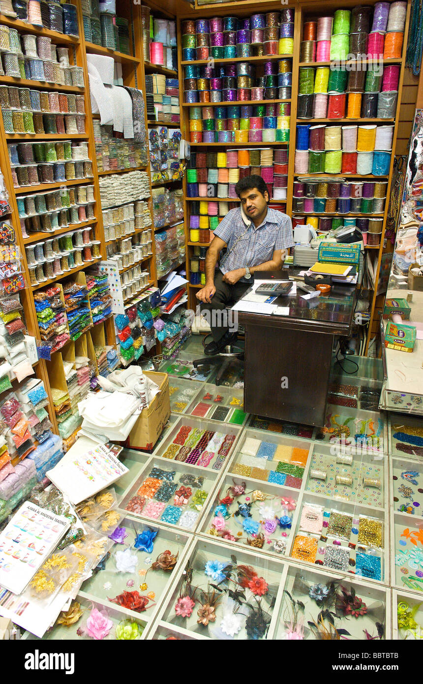 Dubai shop in the old Arab souq selling sewing materials Stock Photo