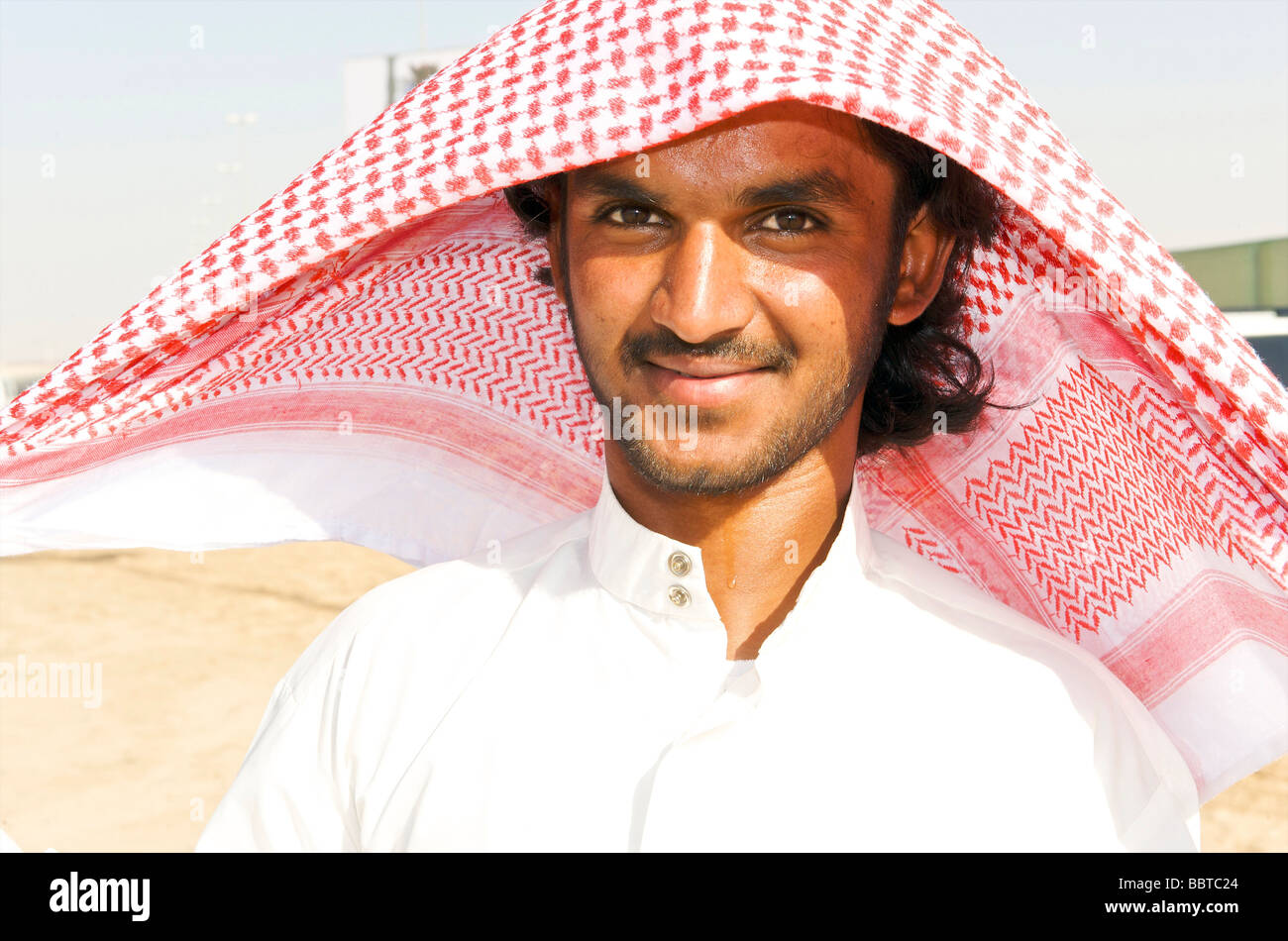 Dubai demonstration of how to attach a headscarf Stock Photo - Alamy