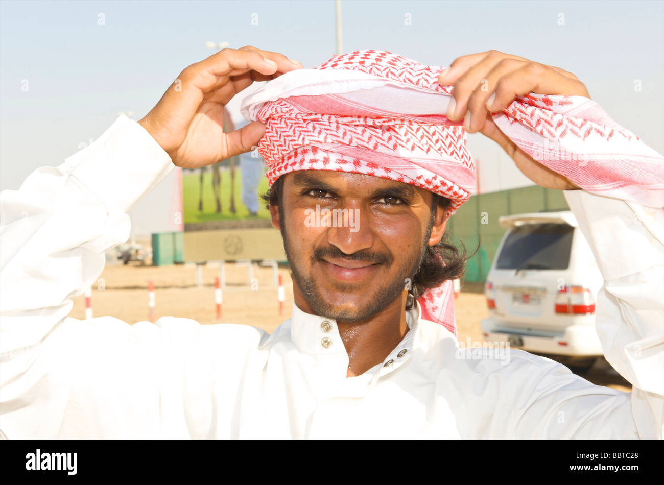 Dubai demonstration of how to attach a headscarf Stock Photo Alamy