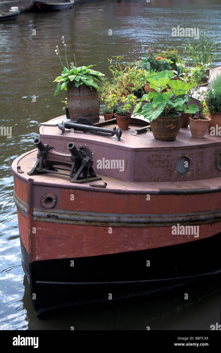 Boat with flowerpots, Amsterdam, Holland, Europe Stock Photo