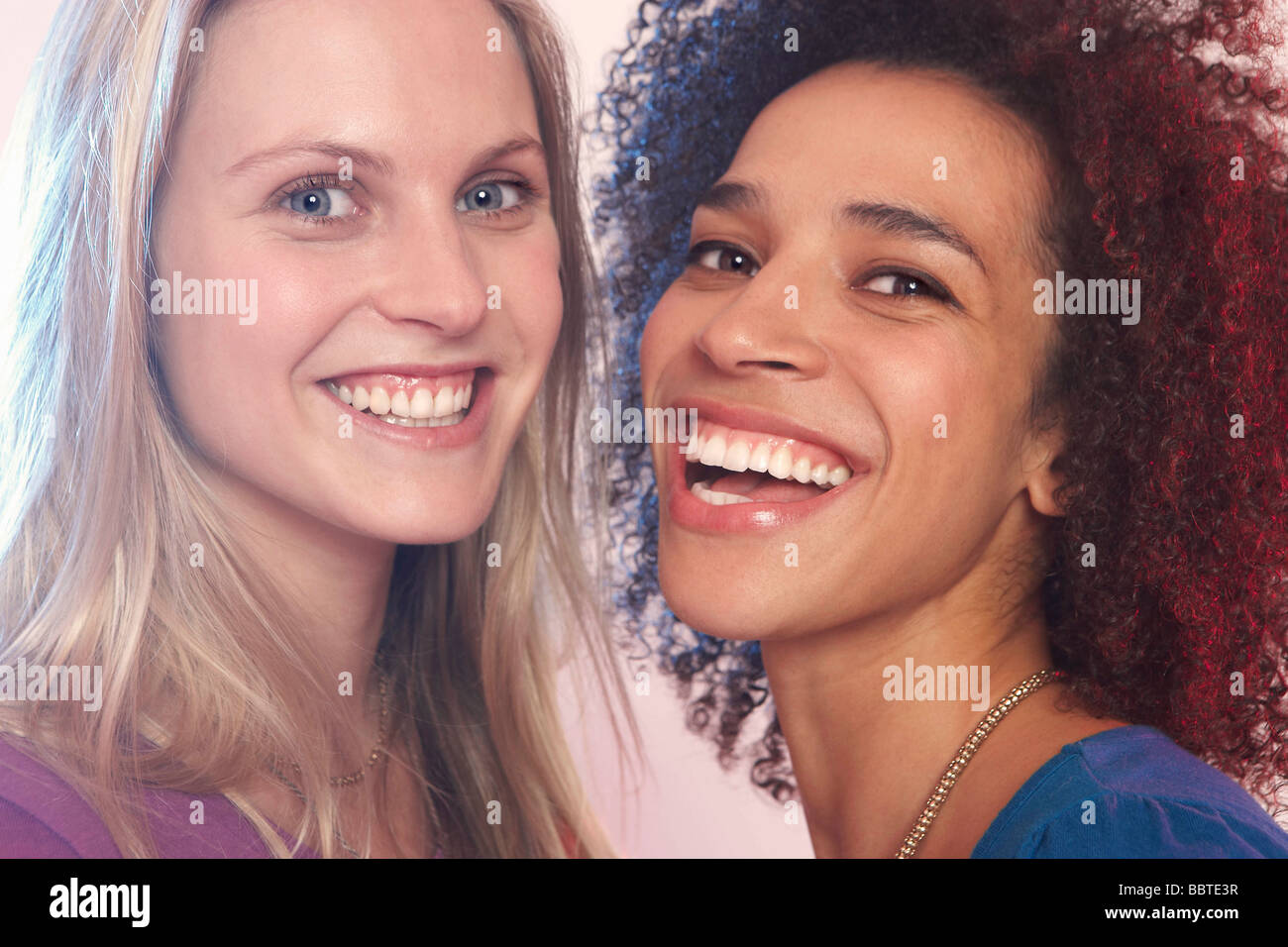 Portrait of two young women laughing Stock Photo - Alamy