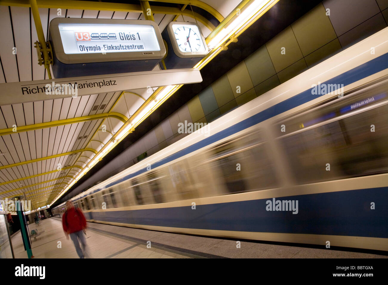 Subway train leaving platform Stock Photo