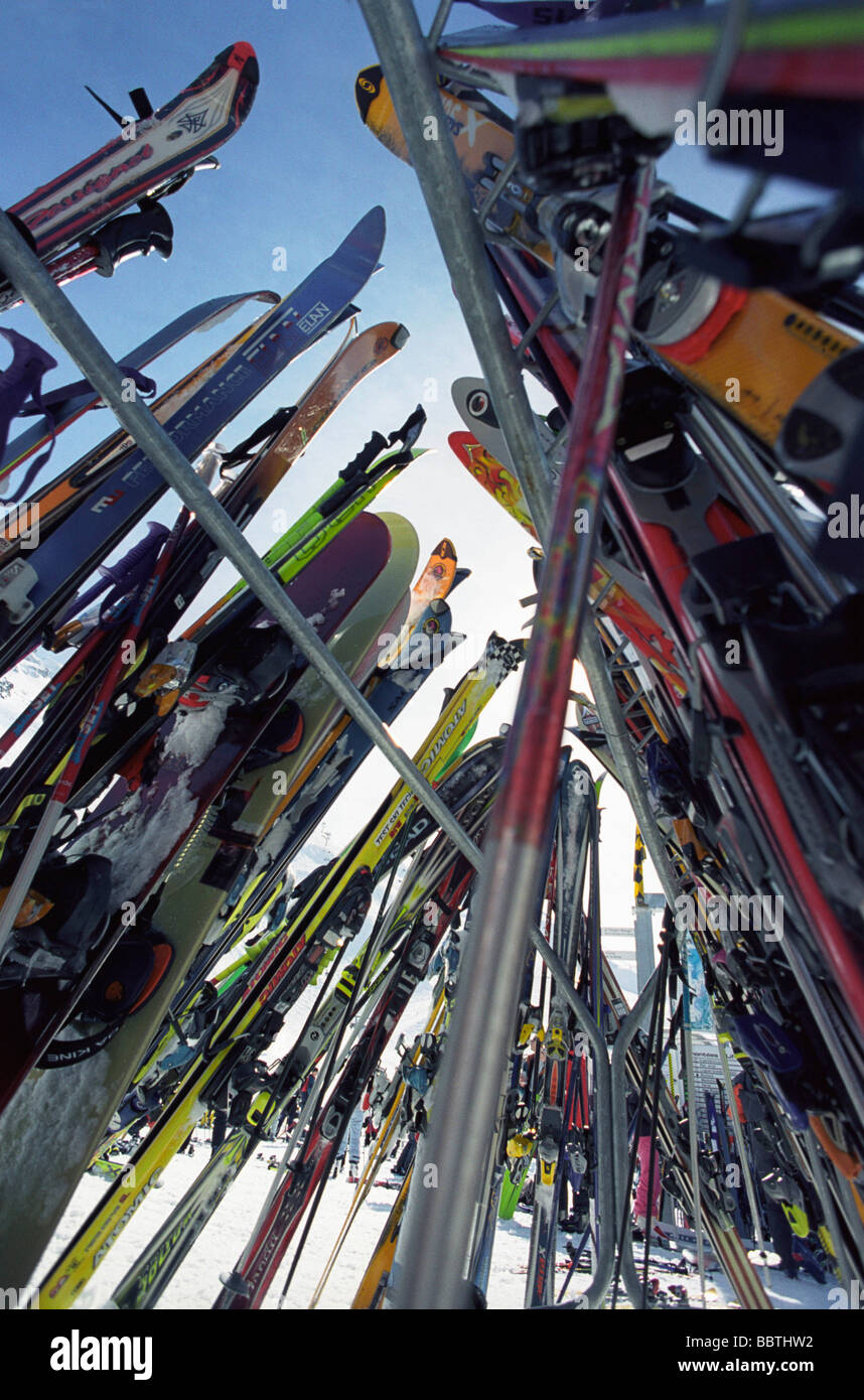 Skis and snowboards in rack Stock Photo Alamy