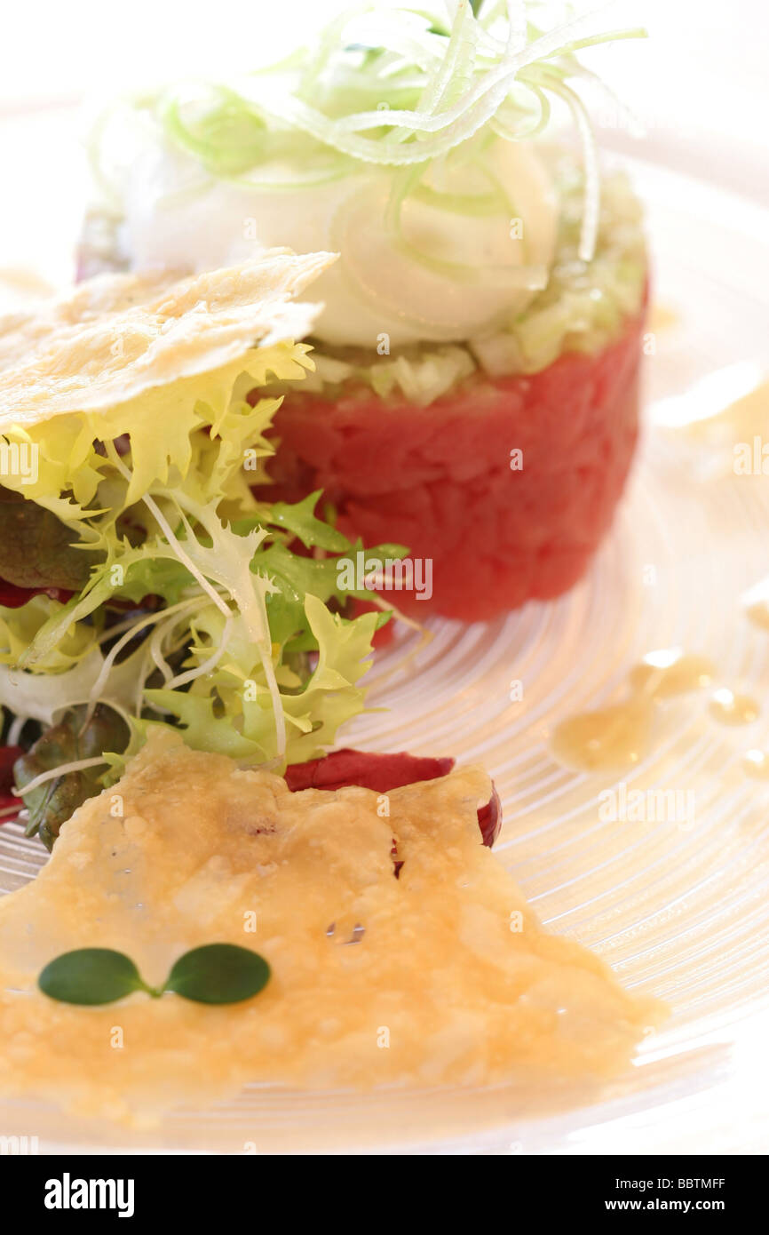 Leg of veal tartare knife cut with celery parmesan cheese cream, salted