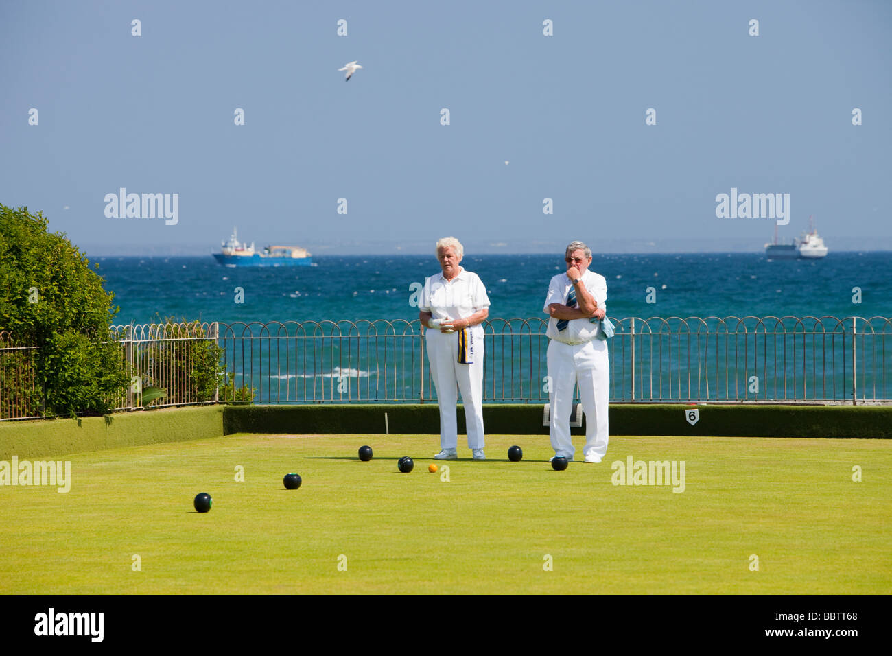 Old people playing bowls at Penzance in West Cornwall UK Stock Photo