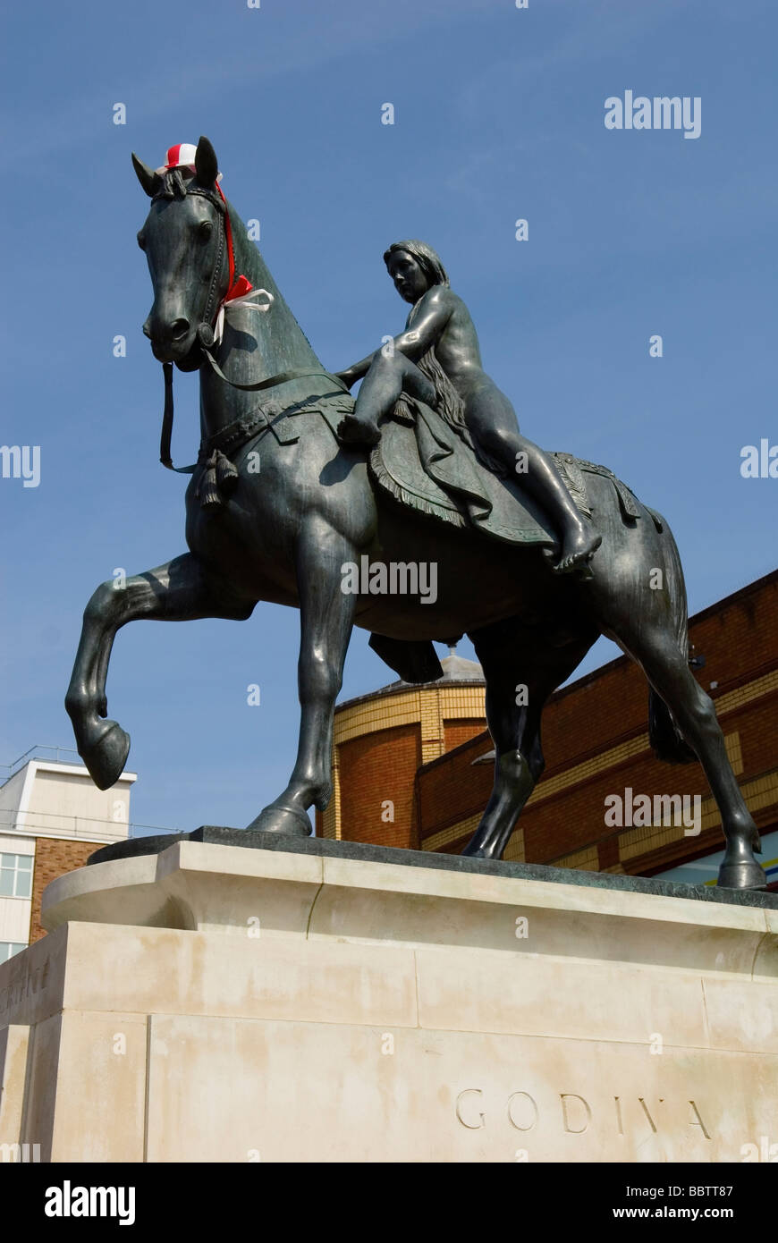 Statue of Lady Godiva wearing red and white hat Stock Photo