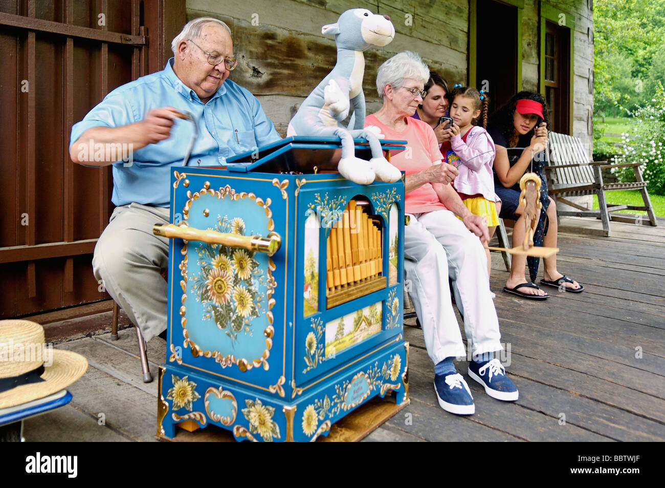 Organ Grinder Performing On Cabin Porch In Spring Mill State Park