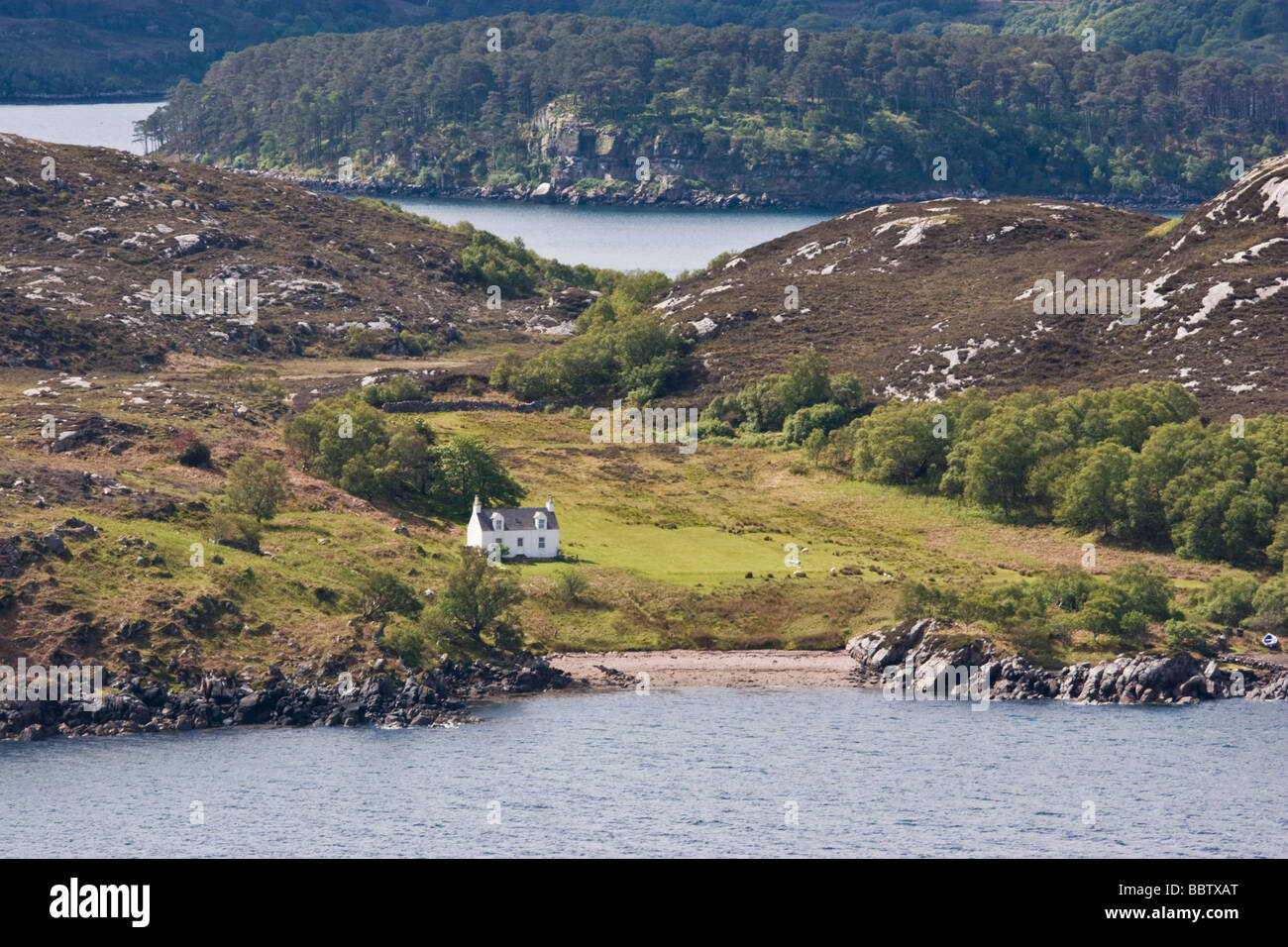 Remote croft house on shore of Loch Torridon Stock Photo