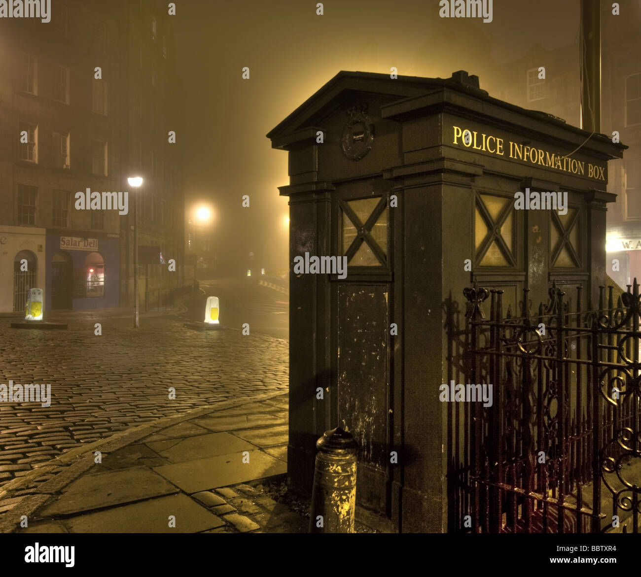 A police box on a foggy night in the Grassmarket, Edinburgh Stock Photo