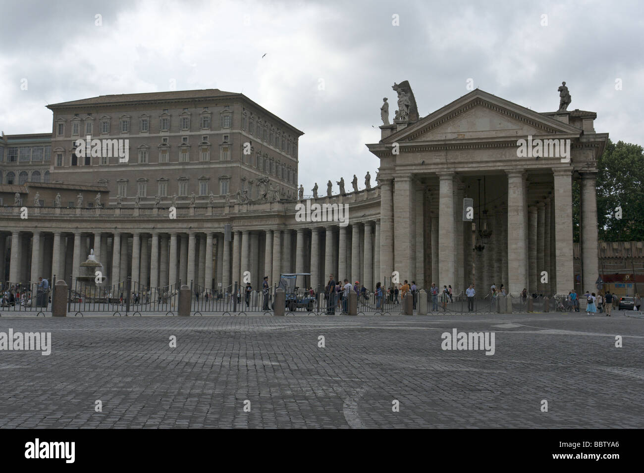 Bernini's colonnade and Palazzo Vaticano in Saint Peter's square in Rome Stock Photo