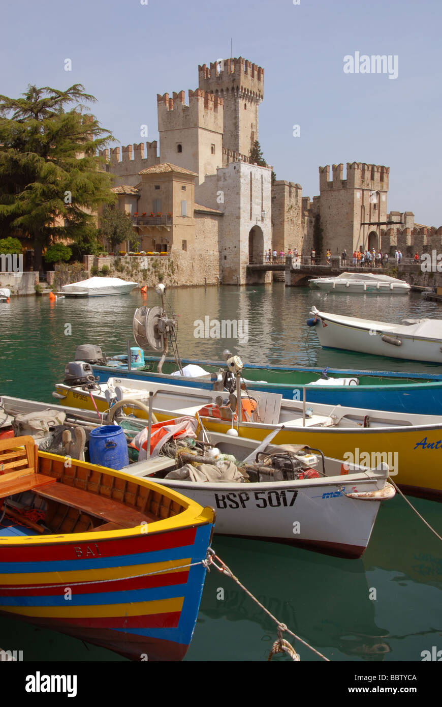 Castle and boats at Sirmione Lake Garda Italy Stock Photo