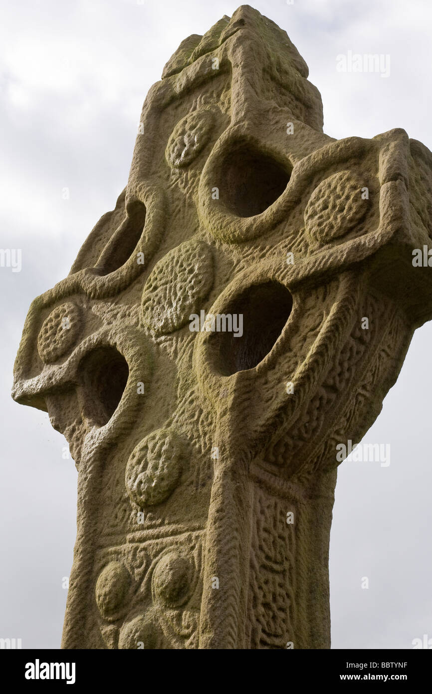East face of the South Cross Replica. A replica of the 9th century South Cross stands in its original position at Clonmacnoise. Stock Photo