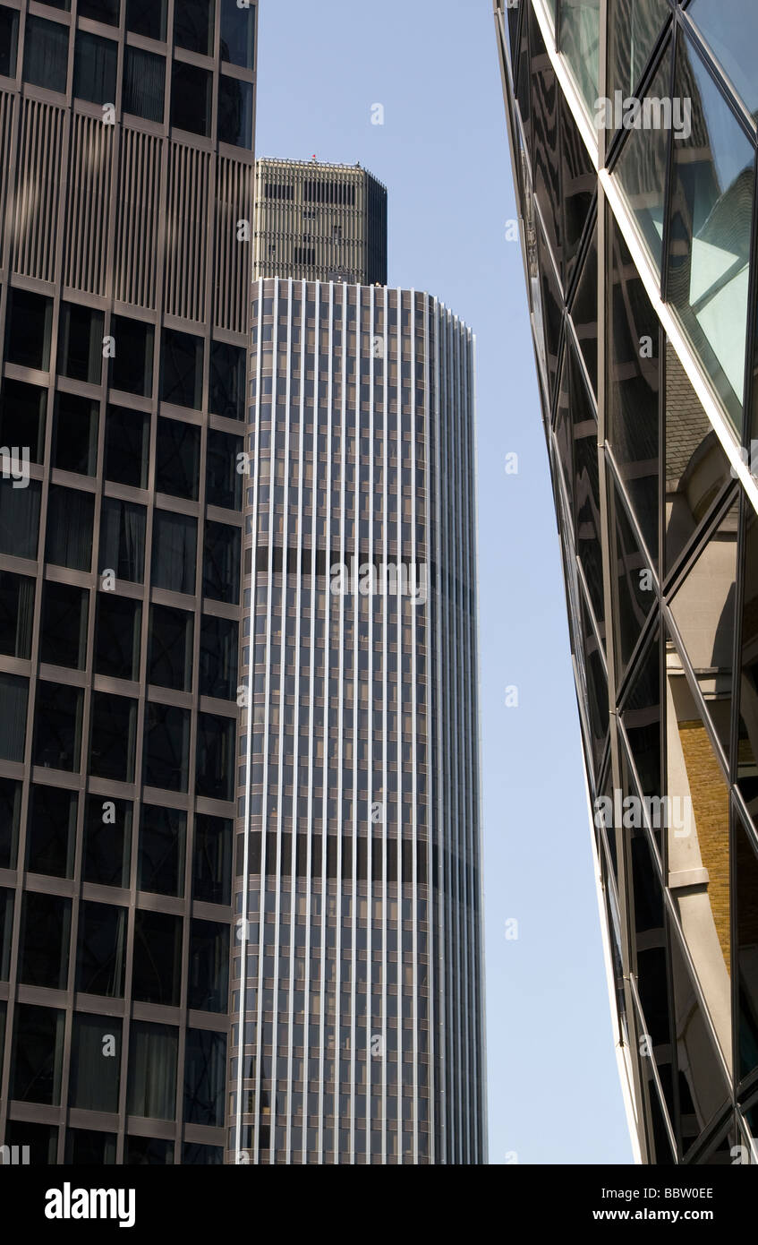 View of the Tower 42 (Natwest Tower) seen between nearby skyscrapers in the City of London Stock Photo