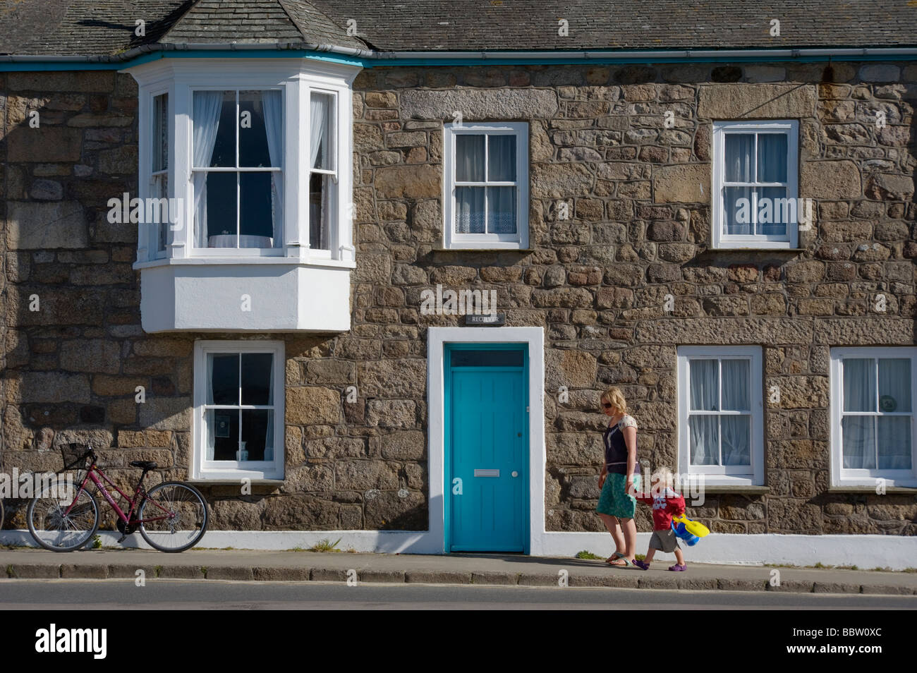 Holidaymakers going to the beach on St Marys island on the Isles of Scilly  England UK Stock Photo