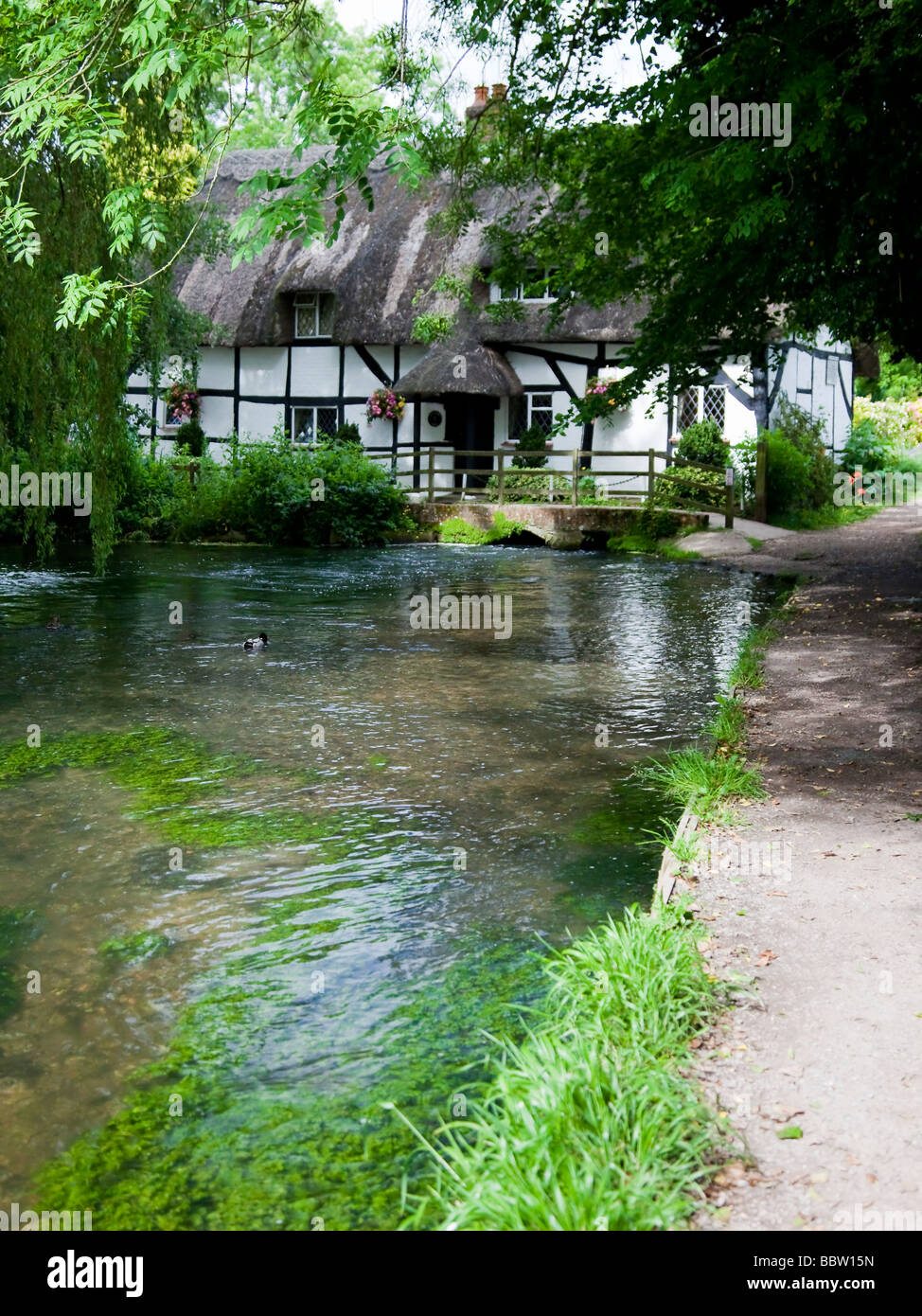 Country cottage with bridge over at Arle Valley Trail, Alresford Hants, Millennium Trail. Stock Photo