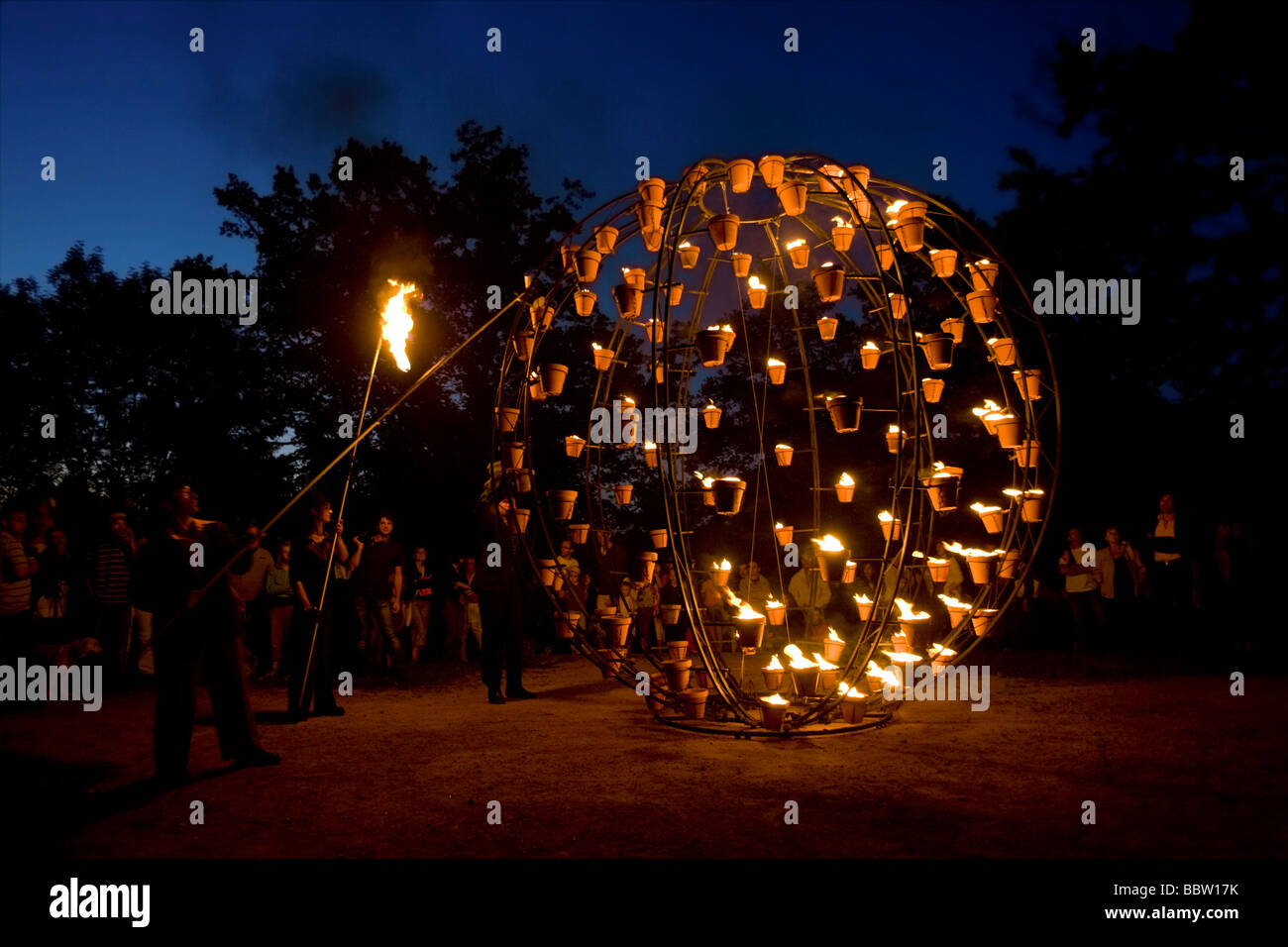 A fire show put on by the 'Carabosse' theatrical Company (Allier - France). Installations de Feu de la Compagnie Carabosse. Stock Photo