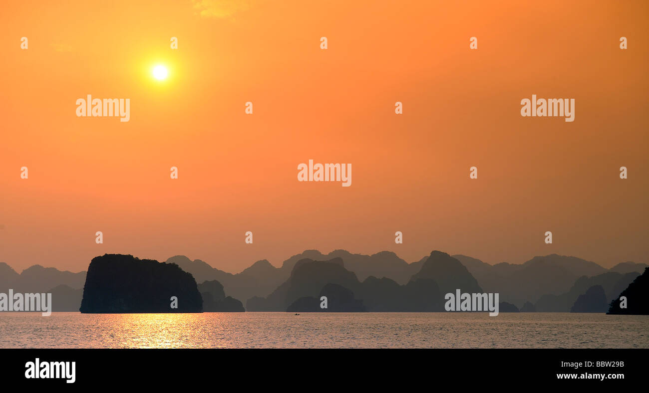 Rock formations at sunset, Halong Bay, Hanoi, Southeast Asia Stock Photo
