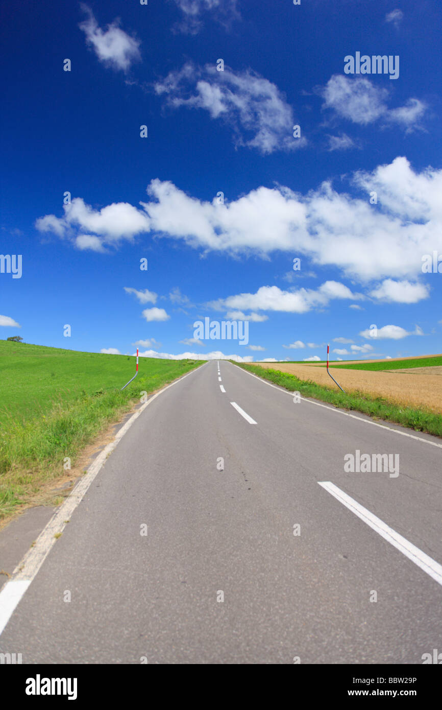 Empty road against cloudy sky Stock Photo