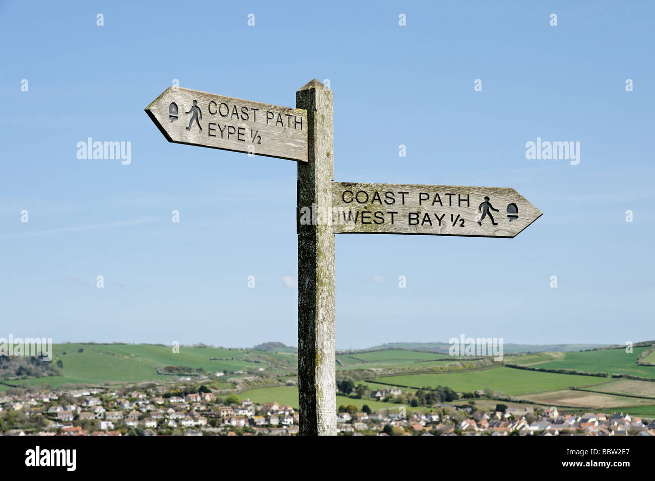 Coastal path sign overlooking West Bay town along the dorset coastline South West England UK Stock Photo