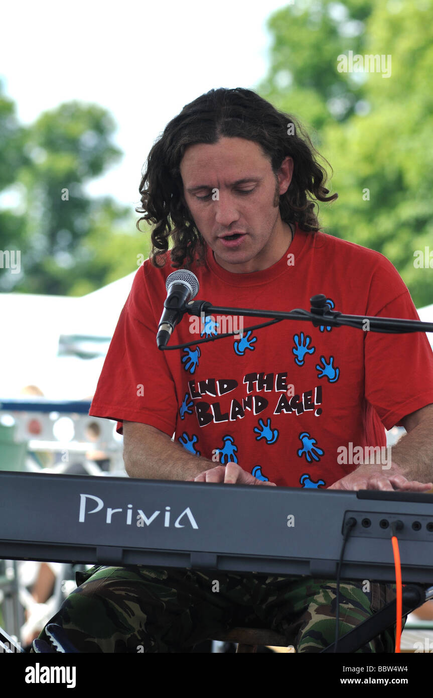 Man playing keyboards and singing at Leamington Peace Festival, UK Stock Photo