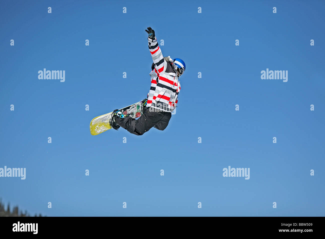 Snowboarder performs a big air in the terrain park. Brighton Ski Resort, Salt Lake City, Utah, USA Stock Photo