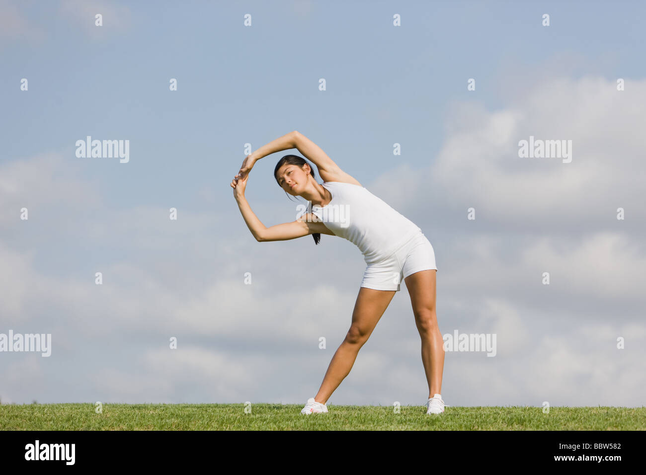 Posing woman bending arms hi-res stock photography and images - Alamy
