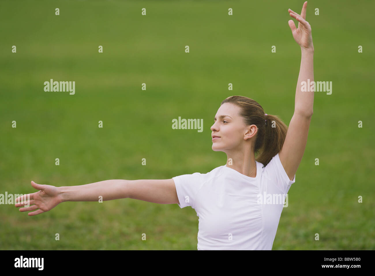 young-woman-widely-stretching-arms-stock-photo-alamy