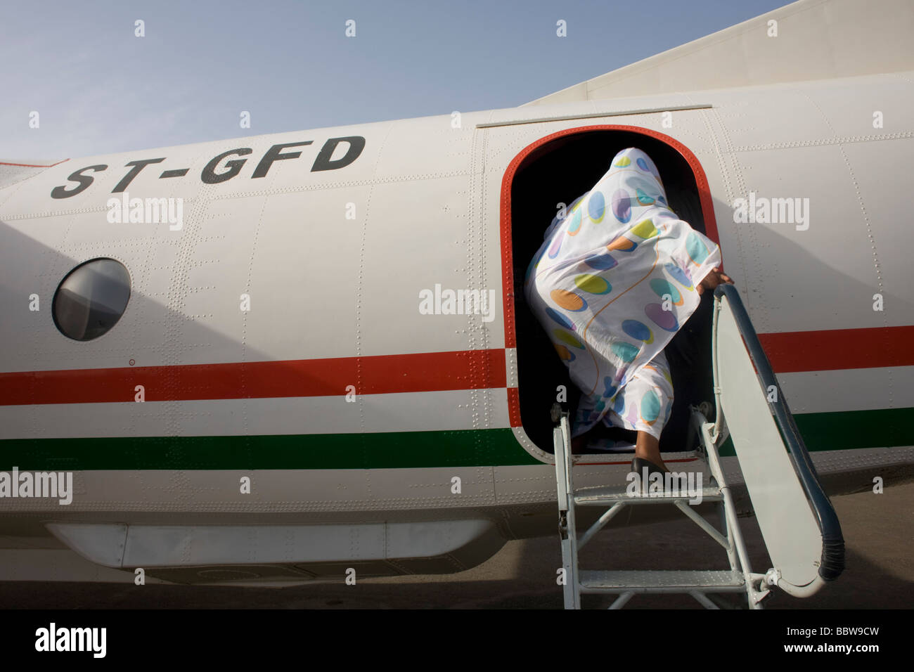 Woman steps plane hi-res stock photography and images - Alamy