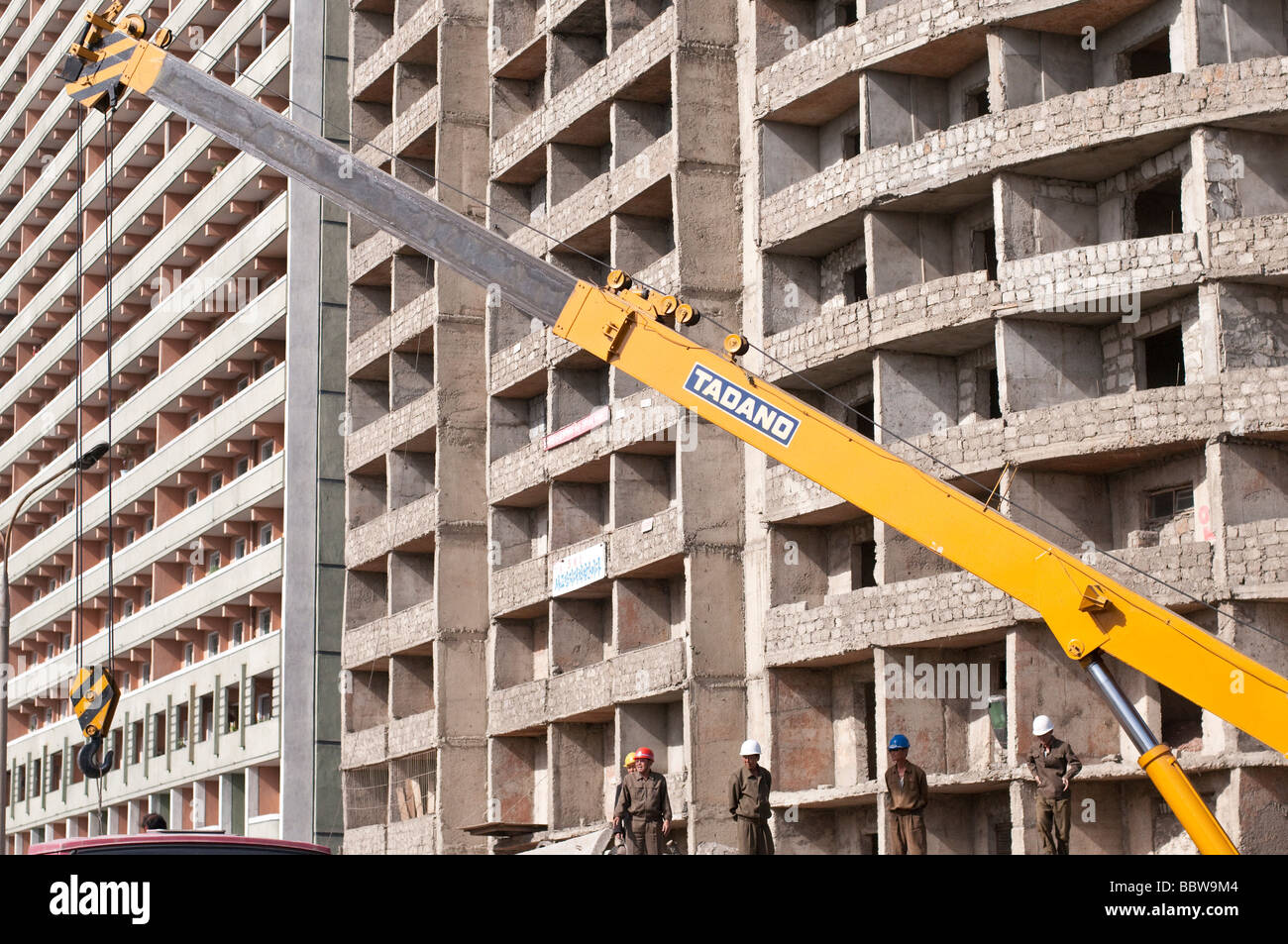 Construction crane with new office and apartment buildings in Pyongyang
