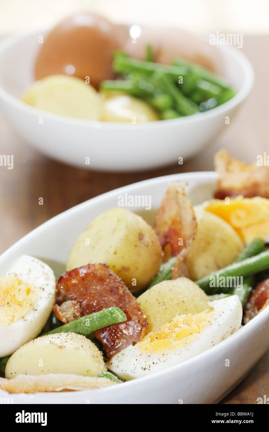 Fresh Healthy Summer Meal Of Hard Boiled Eggs With New Potatoes Bacon And Green Beans And No People Stock Photo